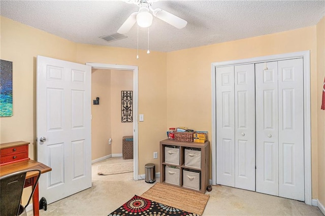 2130 Hampton Trl SE, Conyers, GA 30013 - bedroom with light carpet, a textured ceiling, a closet, and ceiling fan