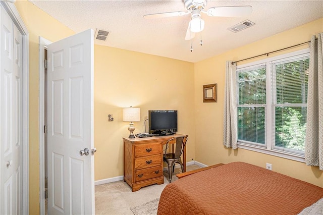 2130 Hampton Trl SE, Conyers, GA 30013 - bedroom with light colored carpet, ceiling fan, and a textured ceiling