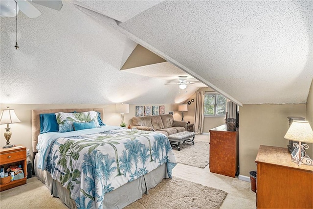 2130 Hampton Trl SE, Conyers, GA 30013 - bedroom featuring light colored carpet, a textured ceiling, vaulted ceiling, and a ceiling fan