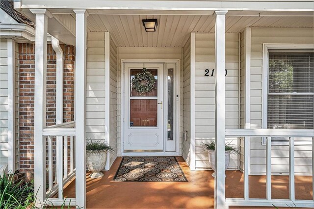 2130 Hampton Trl SE, Conyers, GA 30013 - doorway to property featuring covered porch