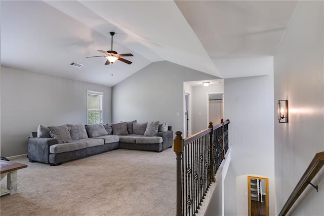 carpeted living area featuring vaulted ceiling and ceiling fan
