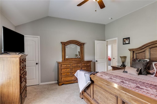 bedroom with lofted ceiling, light carpet, a ceiling fan, and baseboards