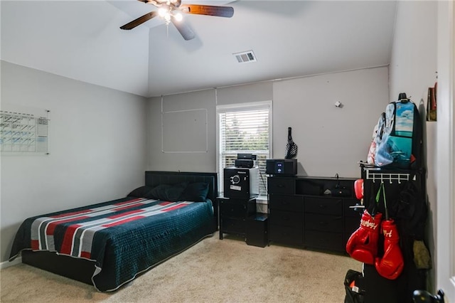 bedroom featuring carpet flooring, vaulted ceiling, and a ceiling fan