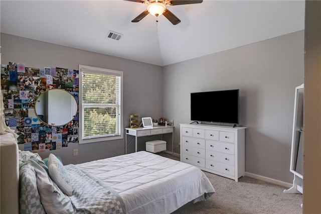 bedroom with carpet, vaulted ceiling, ceiling fan, and baseboards