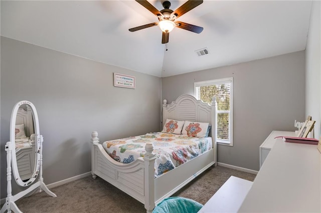 carpeted bedroom featuring baseboards, vaulted ceiling, and ceiling fan