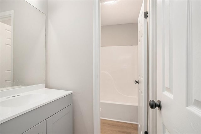 full bath with vanity and wood finished floors