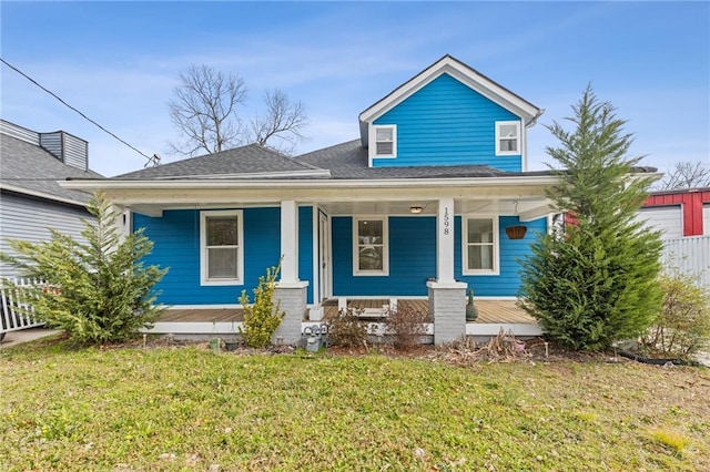 view of front of home featuring a porch and a front lawn