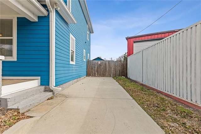 view of side of home featuring a patio area