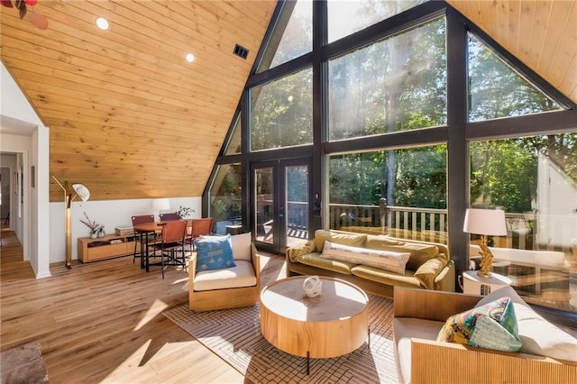 sunroom featuring wood ceiling and vaulted ceiling