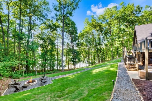 view of yard with a fire pit