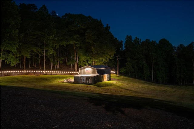 view of yard at twilight