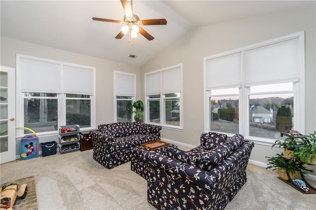 living room featuring visible vents, baseboards, ceiling fan, vaulted ceiling, and carpet floors