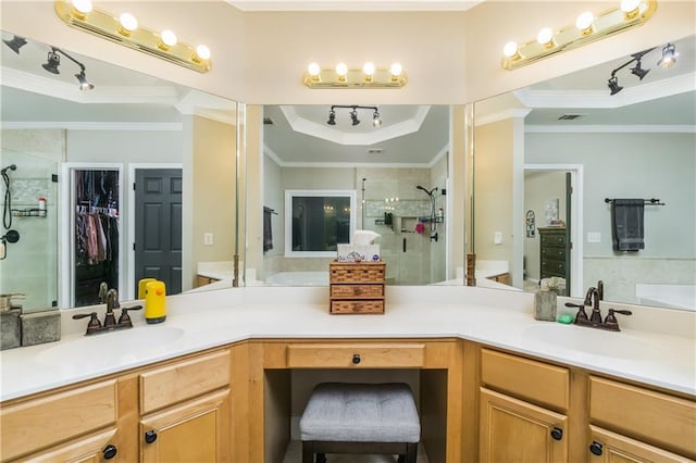 full bathroom featuring visible vents, a raised ceiling, ornamental molding, a walk in closet, and vanity