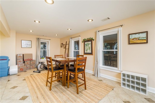 dining space with baseboards, light tile patterned flooring, visible vents, and recessed lighting