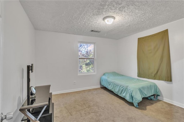 bedroom with carpet, visible vents, and baseboards