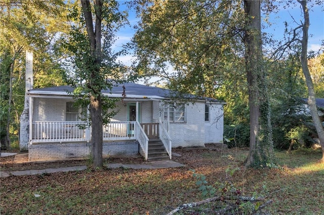 view of front of home featuring brick siding