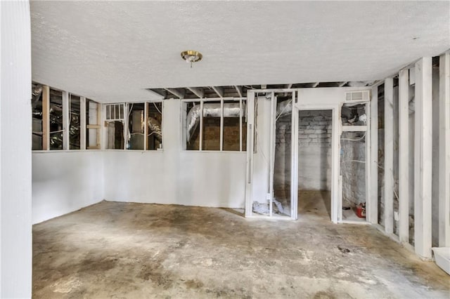 empty room featuring visible vents and a textured ceiling