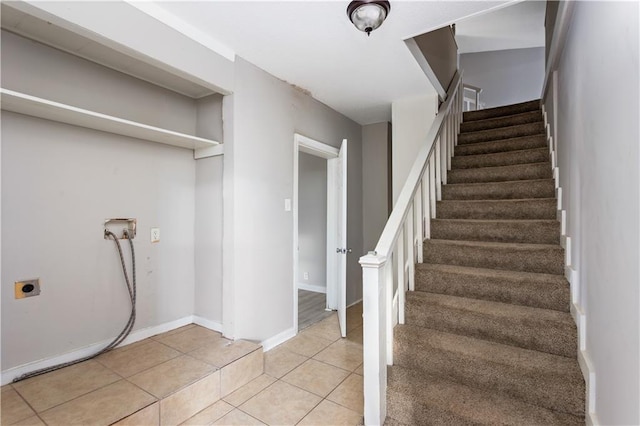 interior space with tile patterned floors and baseboards