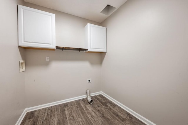 washroom with cabinets, washer hookup, hardwood / wood-style flooring, and hookup for an electric dryer