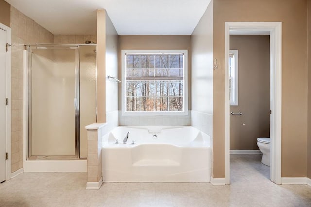 full bath with baseboards, a garden tub, toilet, and a shower stall