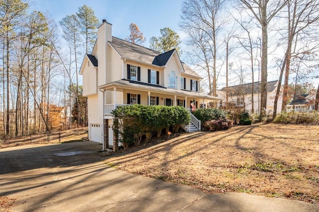 view of front of home with a garage and a porch