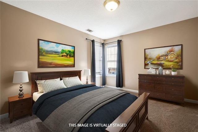 carpeted bedroom with baseboards and visible vents