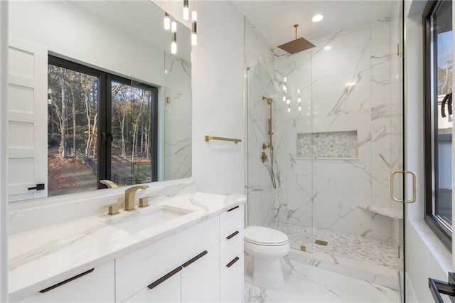 1678 Thomas Dr, Hoschton, GA 30548 - full bath with a marble finish shower, vanity, toilet, marble tiled floors, and recessed lighting
