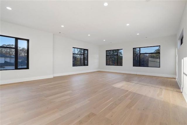 1678 Thomas Dr, Hoschton, GA 30548 - spare room featuring recessed lighting, light wood-type flooring, and baseboards