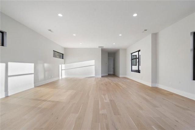 1678 Thomas Dr, Hoschton, GA 30548 - unfurnished living room with recessed lighting, light wood-style flooring, and baseboards
