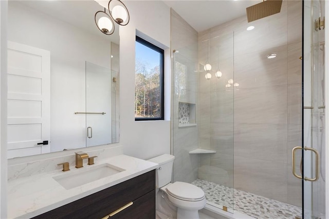 1678 Thomas Dr, Hoschton, GA 30548 - bathroom with vanity, a shower stall, and toilet