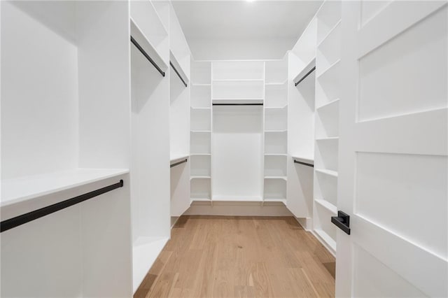 1678 Thomas Dr, Hoschton, GA 30548 - spacious closet featuring light wood-type flooring