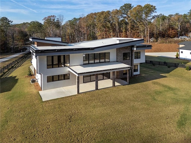 1678 Thomas Dr, Hoschton, GA 30548 - back of house with stucco siding, a patio, and a wooded view