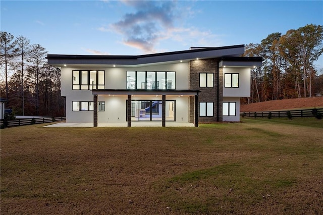 1678 Thomas Dr, Hoschton, GA 30548 - rear view of property featuring a patio area and stucco siding