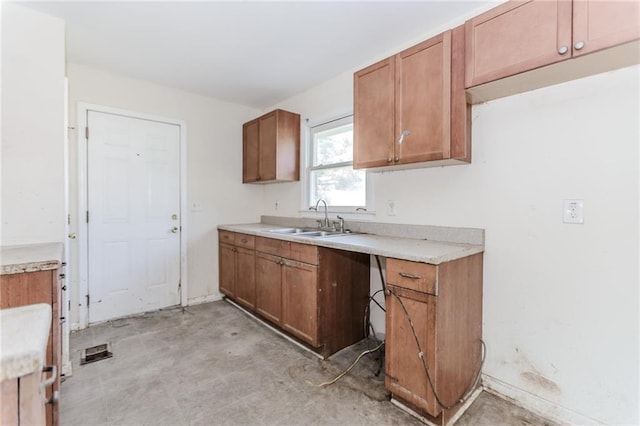 1167 Sanders Dr, Morrow, GA 30260 - kitchen with a sink, brown cabinets, and light countertops