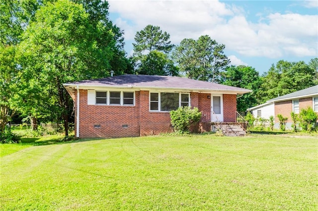 1167 Sanders Dr, Morrow, GA 30260 - view of front of house with a front yard, brick siding, and crawl space