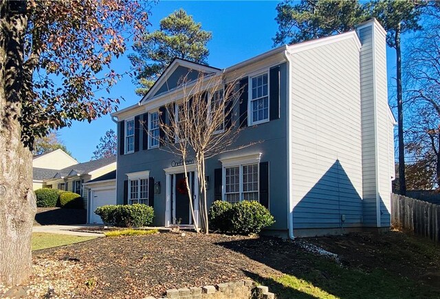 colonial home featuring a garage