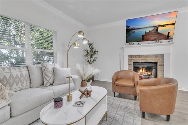 living room featuring wood finished floors, baseboards, crown molding, and a brick fireplace