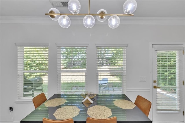 dining room with crown molding