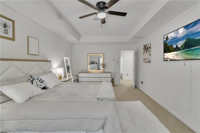 bedroom featuring a raised ceiling, light carpet, ceiling fan, and baseboards