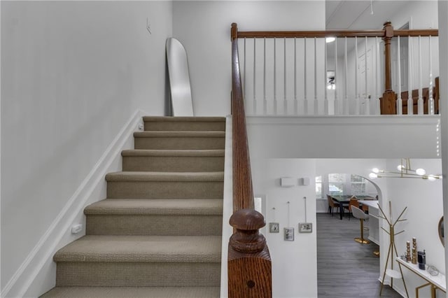 staircase featuring wood finished floors