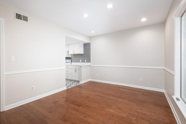 empty room featuring wood-type flooring