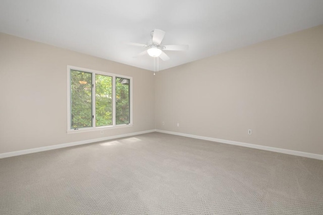 unfurnished room featuring ceiling fan and carpet flooring