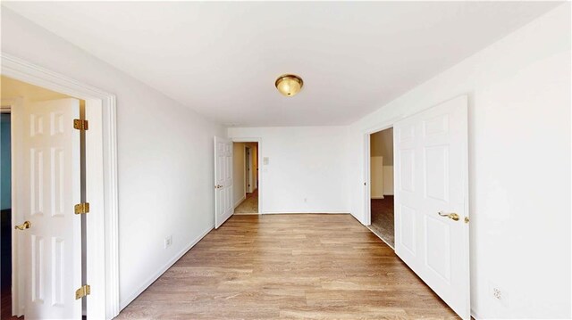 hallway featuring light hardwood / wood-style flooring