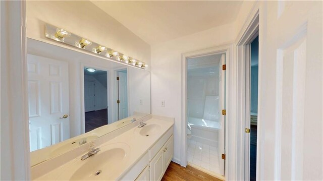 full bathroom featuring vanity, shower / tub combination, hardwood / wood-style flooring, and toilet