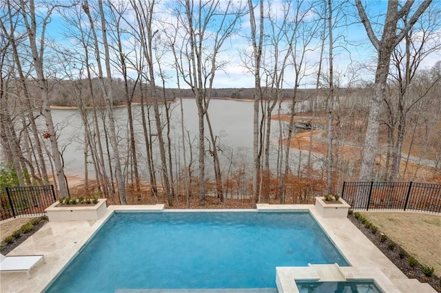 view of pool featuring a water view