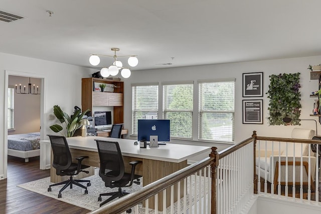 office space featuring a chandelier and dark wood-type flooring