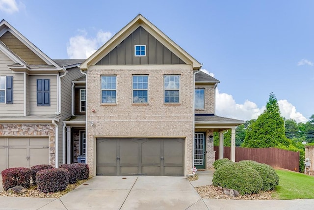 view of front of house featuring an attached garage, concrete driveway, and board and batten siding