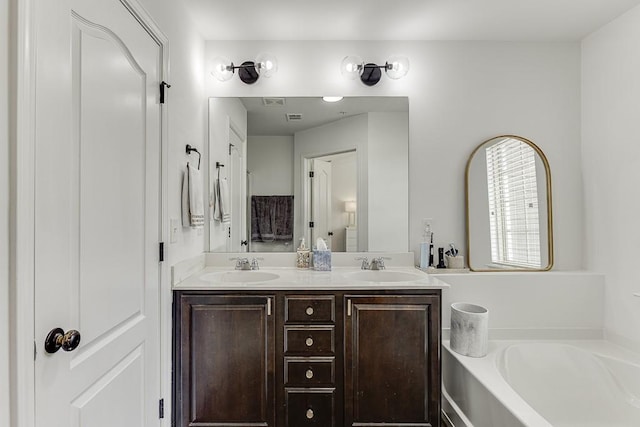 full bathroom featuring a bath and double vanity