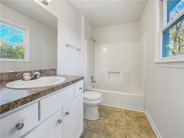 full bathroom featuring toilet, vanity, and shower / washtub combination