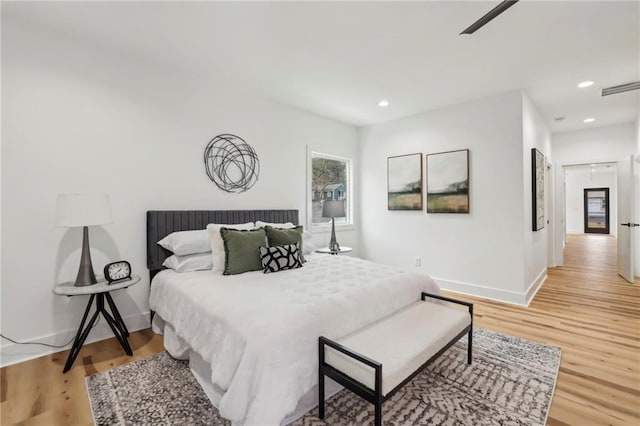 bedroom featuring recessed lighting, visible vents, and light wood-style floors